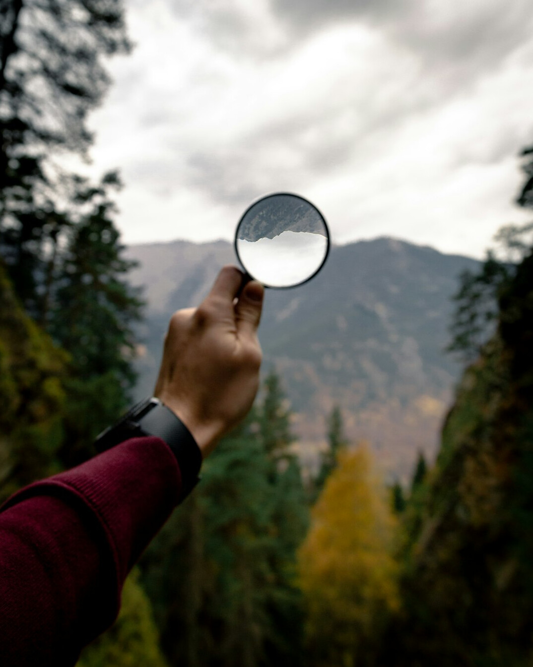 Magnifying glass over a computer screen with code