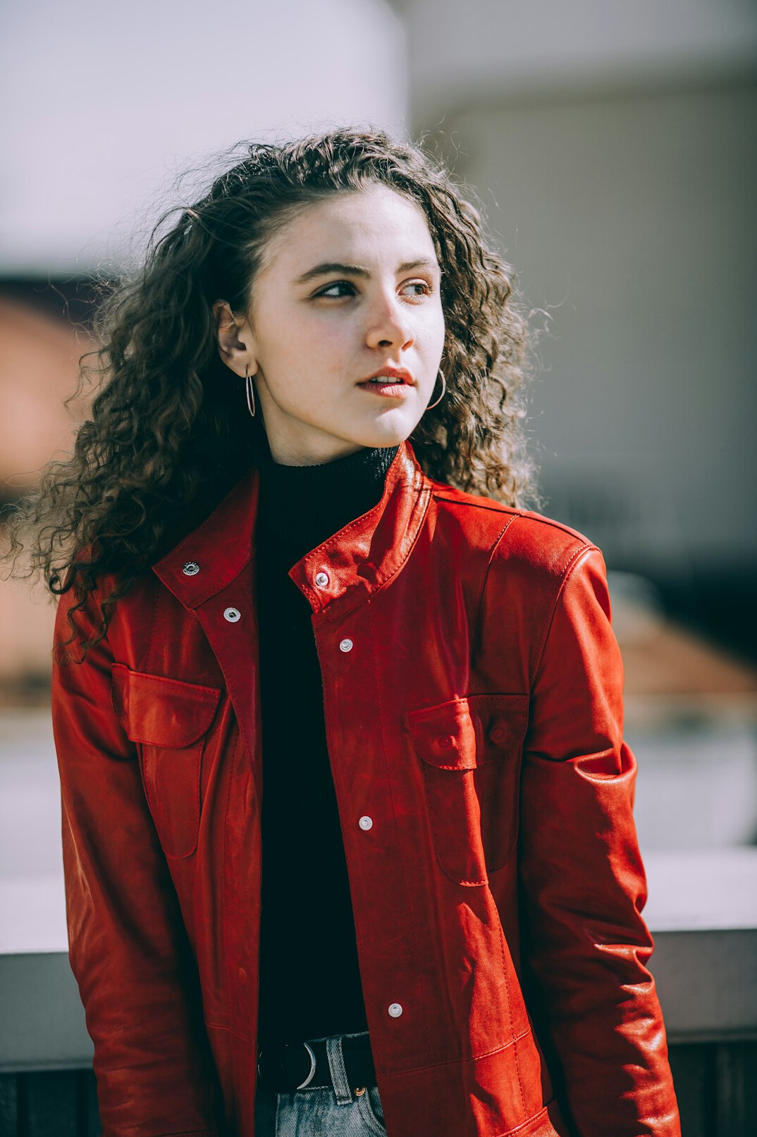 Professional portrait of a young woman with curly hair