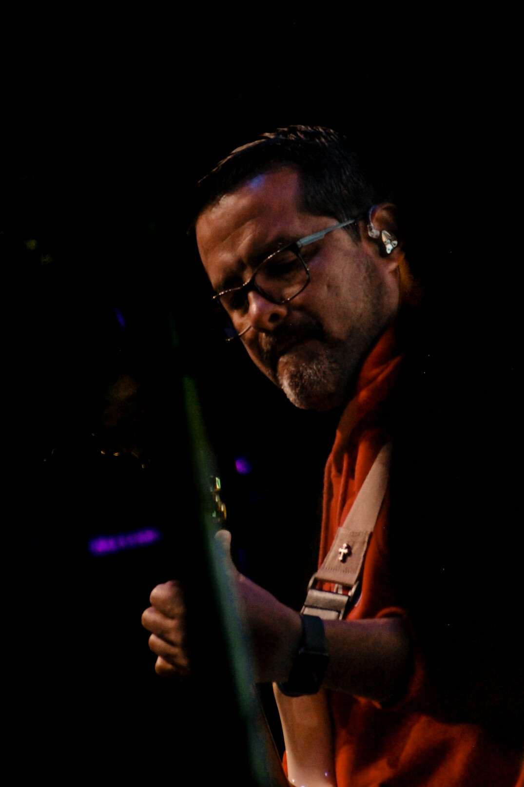 Professional portrait of a man with a beard and glasses