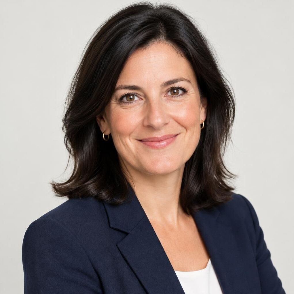 Professional portrait of a woman in her forties with dark hair
